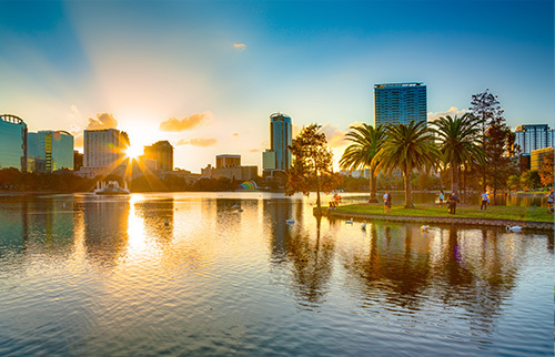 City View of Orlando with the sun setting behind the buildings