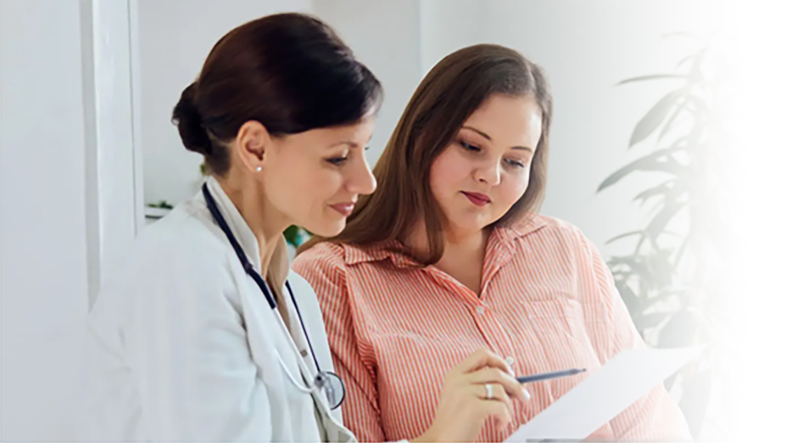 Doctor reviewing patient information with patient